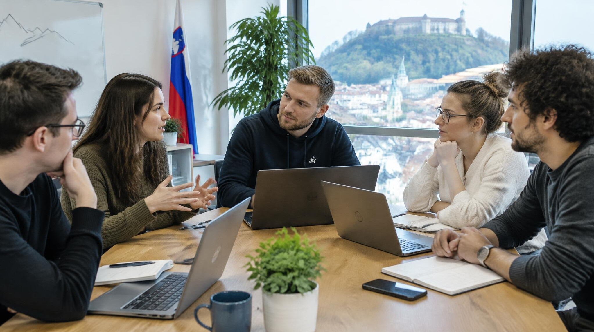 Software development team having a meeting around a table